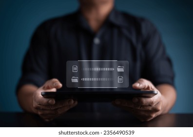 Data Sync concept, Files transfer between folder, Backup data, Exchange of file on folder, Send document in internet, DMS. Hand holding tablet with virtual file document loading to another folder.