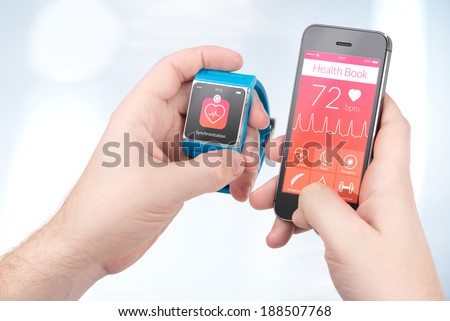 Data synchronization of health book between smartwatch and smartphone in male hands