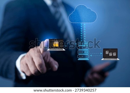Data Synchronize Transfer concept. Man using laptop, AI Data cloud service hologram hud on screen, files share or transfer. Concept of information storage, computer backup and synchronization