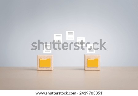 Data Synchronize Transfer, Copy or Move data files between folders, Backup sync data, Exchange files in folder, Send documents to cloud. Wooden blocks with virtual document load to another folder.