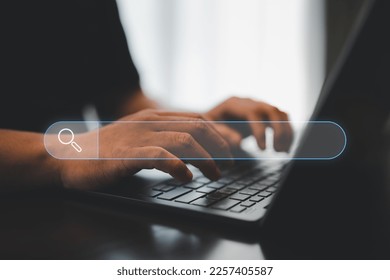 Data and Technology Search Engine Optimization. Man's hands are using a computer laptop to Search for information. Using Search Console with your website.