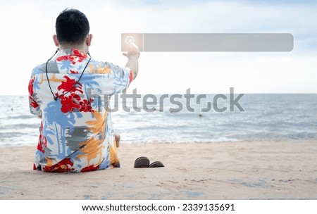 Data Technology Search Engine Optimization is everywhere. Man hands touching the virtual screen search bar for information at the beach. Using Search Console with your website.
