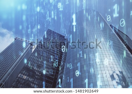 Data theme hologram drawing on city view with skyscrapers background multi exposure. Bigdata concept.
