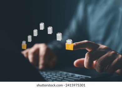 Data transfer concept, File folder connection. Businessman use laptop computer with data transferring between folder storage for information exchange and files sharing. Data management technology. - Powered by Shutterstock - Get 15% off with code: PIKWIZARD15