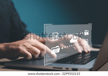 Data Transfer concept. FTP (File Transfer Protocol) files receiver and computer backup. Office man use laptop to copy or sharing document data. Digital system for transferring documents files online.