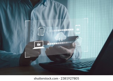 Data transfer concept to a server or hosting service. Business people use smartphone and laptop computer to document file transmission cloud database network technology. Business digital marketing.