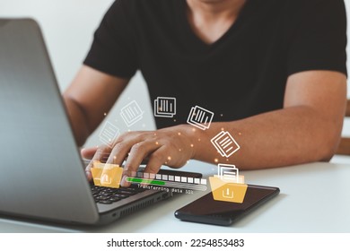 Data transfer, Transfer file of data between folder, Backup data, Exchange of file on folder. Hand using laptop and smartphone waiting for transfer file process with loading bar icon on virtual screen - Powered by Shutterstock