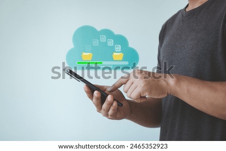 Data transfer, Transfer file of data between folder, Backup data, Exchange of files on cloud, Send of document in internet, DMS. Virtual document loading to another folder and hand holding smartphone