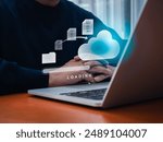 Data transfer service, file migration, backup files concept. Document from folder moving to cloud storage with loading progress bar on laptop computer screen, businessman waiting for send complete.