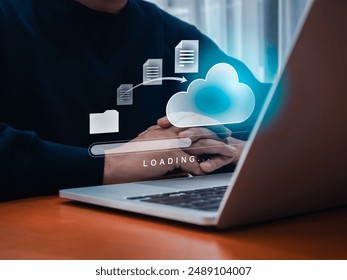 Data transfer service, file migration, backup files concept. Document from folder moving to cloud storage with loading progress bar on laptop computer screen, businessman waiting for send complete. - Powered by Shutterstock