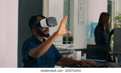 Database admin working with virtual reality glasses to develop server app in it agency office, using source code. Checking programming language on cloud computing database, web developer.