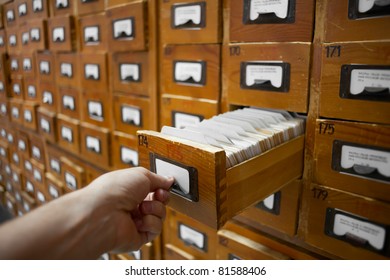 Database Concept. Vintage Cabinet. Human Hand Opens Library Card Or File Catalog Box.