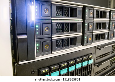 The Database Server Is In The Rack Of The Data Center. Modern Computer Equipment Is Installed In The Server Room. Many Hard Drives Are In A Powerful Router On The Hosting Site.