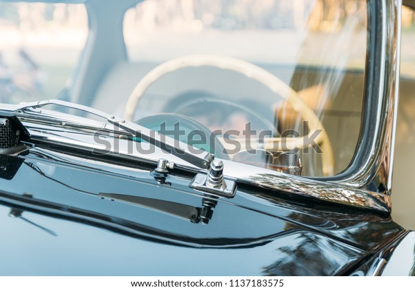 date in the car.people who are lying in the car and
holding hands, kissing. look through the window in the car.View
from the windshield of the black auto through the white steering
wheel.on the