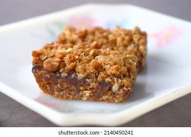 Date Fruit Chocolate Bar In A Plate On Table 