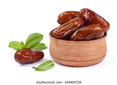 date fruit in wooden bowl isolated on white background