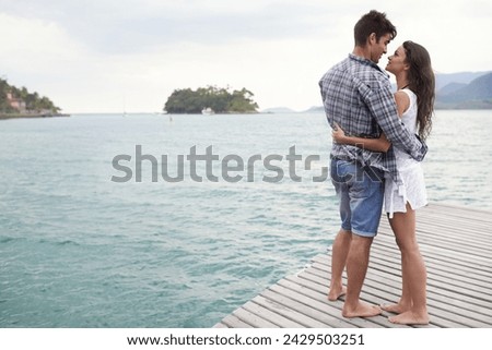 Date, holiday and couple hug by lake in vacation, water and outdoor for nature in summer for romance. Partners, woman and man together to travel, journey and adventure in ocean for love with embrace