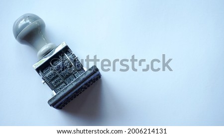 date stamp tool on white table seen from above