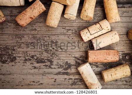 Dated wine bottle corks on the wooden background. Close up