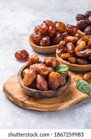 Dates or dattes palm fruit in wooden bowl is snack healthy.