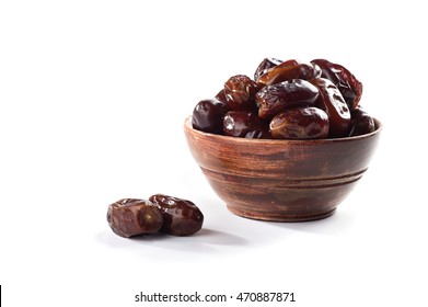 Dates in wooden bowl on white background. dried dates fruit.