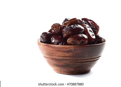 Dates in wooden bowl on white background. dried dates fruit.