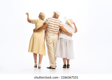 Dating. Handsome Senior Man And Two Charming Women In Vintage Retro Style Outfits Isolated On White Background. Concept Of Relations, Family, 1960s American Fashion Style And Art.