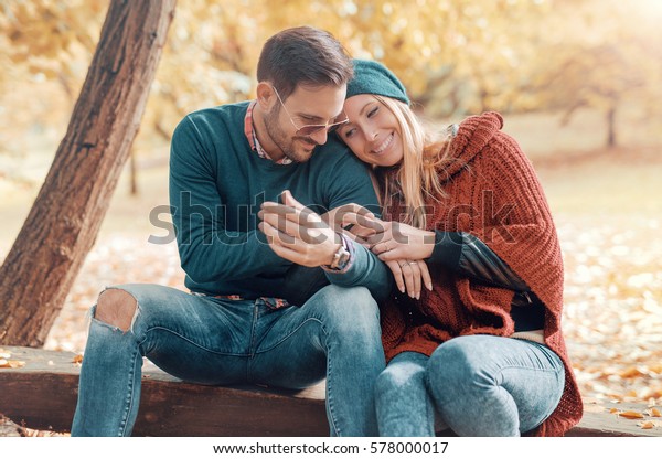 Dating in the park. Romantic couple has beautiful moments of happiness and joy in the autumn park. Love and tenderness. Lifestyle concept