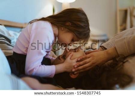 Similar – Newborn baby girl sleeping lying on blanket with her mother