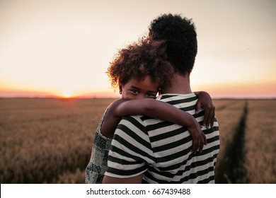 Daughter And Father Sharing An Emotional Hug.