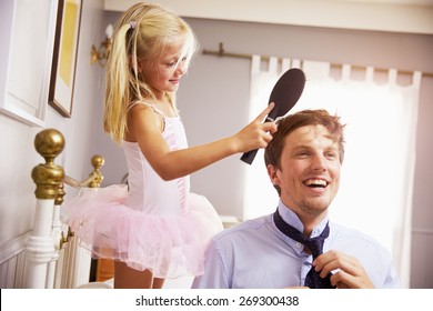 Daughter Helps Father To Get Ready For Work By Brushing Hair