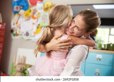 Daughter Hugging Mother Returning From Work