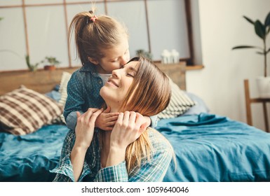 Daughter Hugs Her Mom.