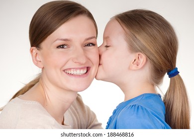 Daughter Kissing Her Mother in Cheek