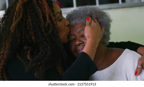 Daughter Kissing Senior Mother On Forehead Authentic Real Life Family Love And Affection