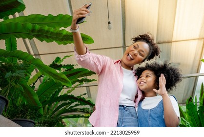 Daughter And Mother Are Doing Self Park Smiling.Close Up Sincere Adorable Little Child Girl Having Fun With Happy Loving Mother.African American Family Facetime With Grandparents.