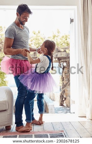 Daughter on father feet, ballet dancing and fun with learning at home in tutu, bond with love and creativity. Family, man and girl dance in living room, ballerina lesson and spending time together