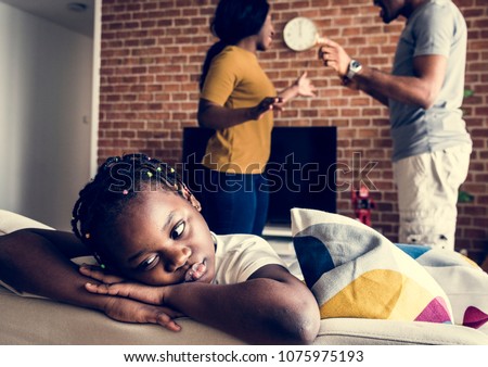 Daughter sad while her dad and mom are fighting