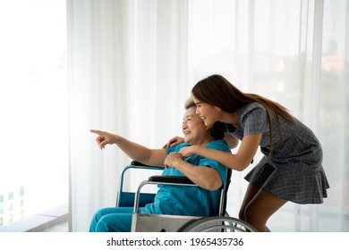 Daughter Of A Senior Patient Taking Care And Encouraging The Mother After Receiving Treatment From The Doctor.