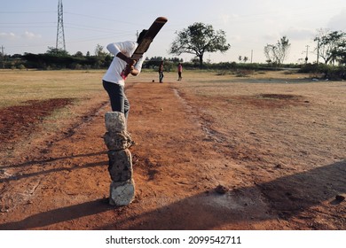 Davangere, Karnataka, India - Jan 01, 2022: A Few Village Indian Boys Are Playing Gully Cricket.