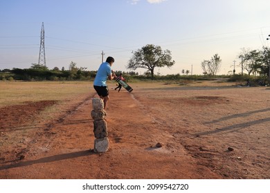 Davangere, Karnataka, India - Jan 01, 2022: A Few Village Indian Boys Are Playing Gully Cricket.