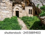 At Davelis cave church on mountain Penteli in Attica, Greece. Located on Mount Penteli in Attica, Greece, there is a cave church.