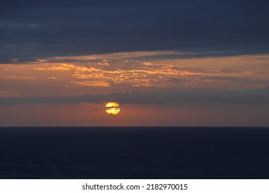 Dawn Break Sun Over Overcast Ocean Horizon