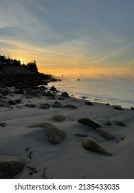 Dawn Breaking Over The Sandy Misty Ocean View