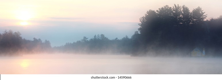 Dawn Mist Over A Lake In Old Forge, New York