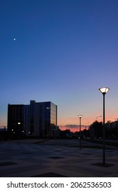 Dawn Over The City. Sunset In The Evening Town Square