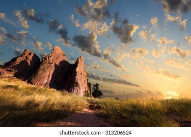 Dawn Over Red Rocks And Grass Fields In Boulder, CO