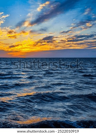 Dawn sky over Chesapeake Bay and choppy water