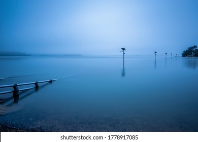 Dawn view of flood tide over streetlamps of a bridge connecting Ungdo Island near Seosan-si, South Korea