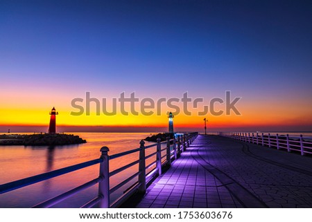 Dawn view of two lighthouses against East Sea at Cheongsapo Harbor near Busan, South Korea